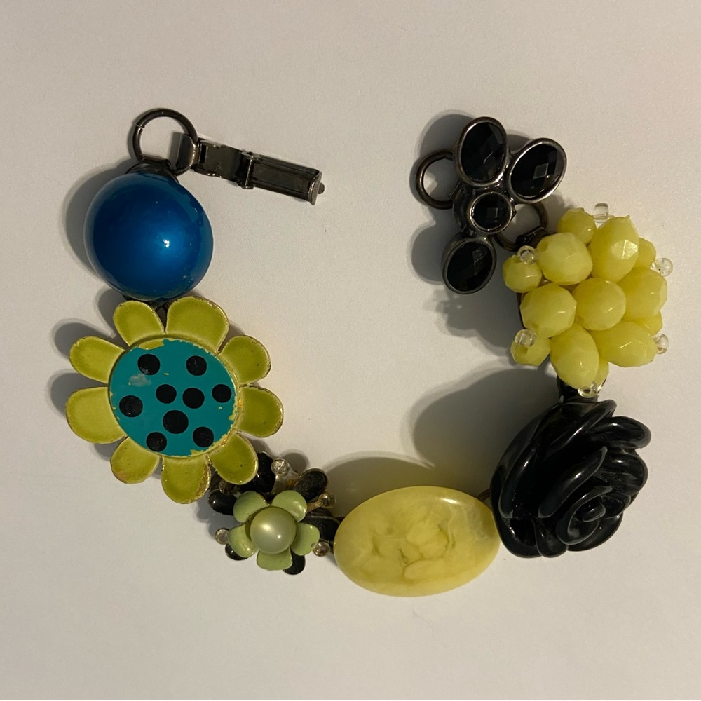 One of a kind bracelet made with vintage/antique earrings and brooches!